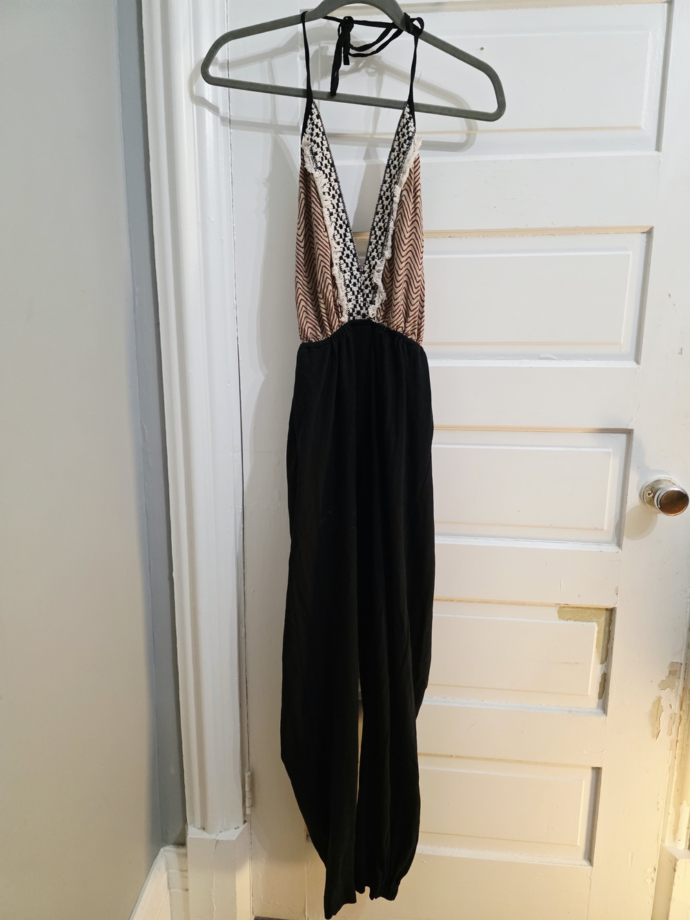 Sleeveless Halter Jumpsuit with Patterned Bodice and Black Pants